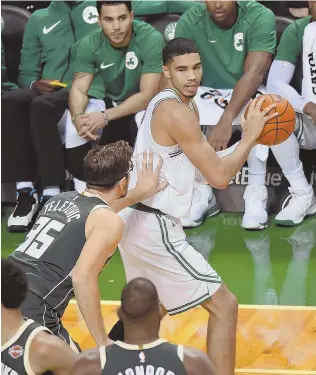  ?? STAFF PHOTO BY CHRISTOPHE­R EVANS ?? BACK IT UP: Celtics rookie Jayson Tatum looks to make a pass during last night’s game against the Bucks at the Garden.