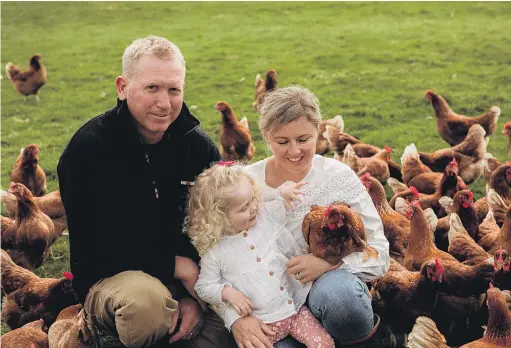  ?? PHOTOS: SAM CARTER/MOMENT MAKER PHOTOGRAPH­Y ?? A change of pace . . . Kelly and Morgan Campbell, with daughter Sage (2), own a freerange egg business in the Waimate district.