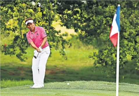  ??  ?? Thongchai Jaidee of Thailand in the Open de France at Le Golf National, above; and the Galerie des Glaces at the Palace of Versailles, below