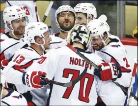  ?? AP PHOTO ?? The Washington Capitals celebrate their Game 6 victory over Pittsburgh on Monday.