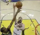  ?? MARCIO JOSE SANCHEZ — THE ASSOCIATED PRESS FILE ?? Cleveland’s Kevin Love, center, shoots against Golden State’s Kevin Durant during Game 2 of the NBA Finals in Oakland. The Associated Press