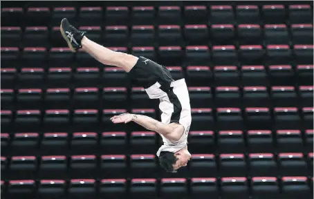  ?? PHOTOS: DAN JANISSE ?? A Cirque du Soleil performer flies through the air Thursday during a rehearsal of Corteo at the Little Caesars Arena in Detroit.