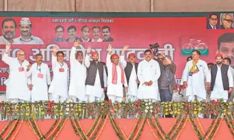  ?? PTI ?? Seeking votes: Samajwadi Party president Akhilesh Yadav with party leaders at an election rally in Mirpur, Muzaffarna­gar, on Saturday.