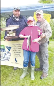  ?? ANN DAVIDSON ?? Ten-year-old Allie Woodard of Knowlton won the award for “nicest fish” at this year’s fishing derby hosted by the Brome-bolton Fish and Game Club.