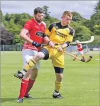  ?? Photograph: Neil Paterson. ?? Inveraray’s Ali MacDonald tries an unorthodox method of shielding the ball from Inverness player Craig Nicholson.