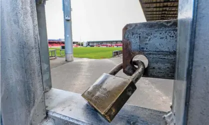  ??  ?? Locked gates at Crewe Alexandra’s home, the Alexandra Stadium, as a result of the Covid-19 lockdown which began in March. Photograph: Peter Byrne/PA