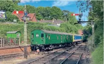  ?? R. BAINES ?? The operation of an all-electric train on a heritage railway provided a unique spectacle and experience. EPBPG’s stock is shunted at the Watercress Line at Alresford on July 14 following arrival from Southall. Leading is MLV No. 68001, NSE -liveried No. 68002/9002, 2-EPB set No. 5759 with WCR Class 33 diesel-electric No. 33025 at the far end providing the power on this occasion.