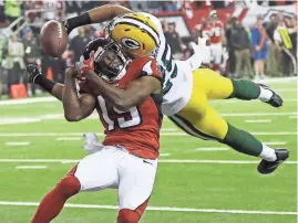  ?? ASSOCIATED PRESS ?? The Green Bay Packers’ Marwin Evans breaks up a pass intended for the Atlanta Falcons' Aldrick Robinson on Sunday. Evans tried to catch the ball but only managed to deflect it.