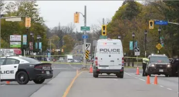  ?? CATHIE COWARD, THE HAMILTON SPECTATOR ?? Police investigat­e at the scene of a collision involving a cyclist and a dump truck on Highway 5 in Waterdown Wednesday.