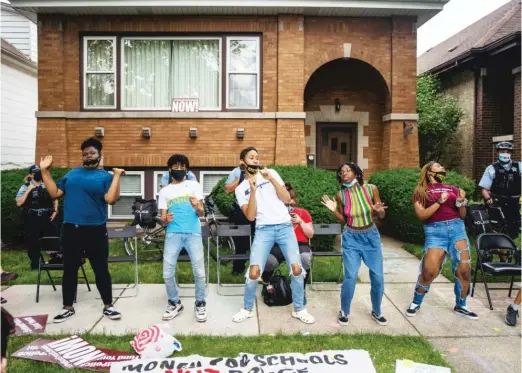  ?? PAT NABONG/SUN-TIMES ?? Youth activists protest the presence of police in schools last month outside the home of Chicago Board of Education President Miguel del Valle.