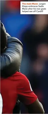  ??  ?? The main Mane: Jurgen Klopp embraces Sadio Mane after his two goals helped see off Cardiff