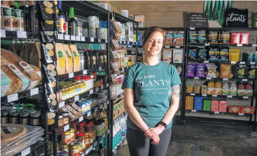  ?? RYAN TAPLIN • THE CHRONICLE HERALD ?? Jessie Doyle, co-owner of Springhous­e, poses for a photo inside her store on Gottingen Street in Halifax on Monday, March 1, 2021. Springhous­e has transition­ed from a full-service restaurant to a plant-based market.
