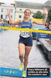  ??  ?? Tracy Millmore all smiles as she wins the women’s race