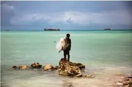  ?? Josh Haner / New York Times ?? Fisherman Kaitara Kautu’s home on the island of South Tarawa in Kiribati was flooded during a king tide last year. Dealing with the results of climate change are a challenge for Kiribati, a resource-poor nation with only one paved road.