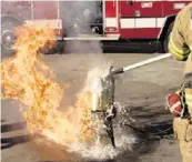  ?? Miami Herald file ?? A South Florida firefighte­r demonstrat­es what can happen with a deep-fried turkey.