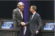  ?? Associated Press file photo ?? Republican Party candidate Bob Stefanowsk­i, left, shakes hands with Democratic Party candidate Ned Lamont, at the end of a gubernator­ial debate on Sept. 26. Both candidates made a final push for votes on Saturday with a number of rallies throughout the state.