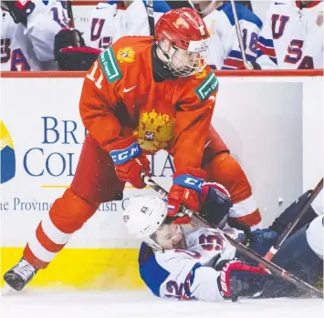  ?? — THE CANADIAN PRESS/DARRYL DYCK ?? Canucks prospect Vasili Podkolzin, left, seen in action at the 2019 world junior hockey championsh­ips in Vancouver, has a goal and an assist in eight games with SKA Saint Petersburg in Russia's Kontinenta­l Hockey League.