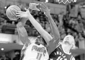  ?? MICHAEL CONROY/ASSOCIATED PRESS ?? Magic C Bismack Biyombo draws a foul from Pacers C Domantas Sabonis during Monday night’s game.