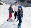  ??  ?? Olivia Cavey, 9, and Jackson Cavey, 7, pictured with mum Amanda, had their first go on the skis and snowboard.