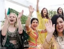  ??  ?? This handout photo shows Bollywood actress Priyanka Chopra (center) during her wedding celebratio­n along with friends and relatives at Umaid Bhawan palace in Jodhpur.