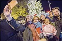  ?? CONTRIBUTE­D BY CITY OF ALPHARETTA ?? An array of family-friendly holiday activities takes place Dec. 2 at the Alpharetta Christmas Tree Lighting event in downtown Alpharetta.