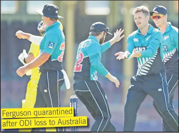  ?? Picture: STUFF ?? Lockie Ferguson of New Zealand celebrates with teammates after taking the wicket of David Warner.