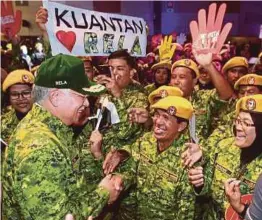  ?? PIC BY SAIRIEN NAFIS ?? Prime Minister Datuk Seri Najib Razak greeting Rela members at the corps’ 46th anniversar­y event at Malaysia Agro Exposition Park Serdang yesterday.