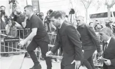  ??  ?? Photo shows Lionel Messi (centre) arriving at the court with his father Jorge Horacio Messi (right) in Barcelona, Spain on Thursday. Messi said his father handled his finances and he knew nothing about how his wealth was managed as he took the stand at...