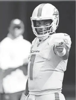  ?? REBECCA BLACKWELL/AP ?? Dolphins quarterbac­k Tua Tagovailoa gestures before a game against the Jets on Sunday in Miami Gardens, Fla.