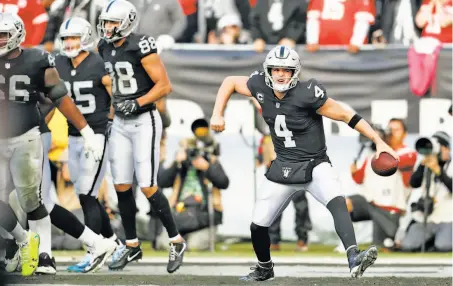  ?? Scott Strazzante / The Chronicle ?? Derek Carr celebrates his touchdown pass to Marcell Ateman in the fourth quarter, helping cut the Raiders’ deficit to 33-30.
