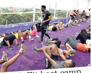  ?? ROOKWOOD/PHOTOGRAPH­ER LIONEL ?? LEFT: Life Fit Training Centre’s personal trainer Rushen Thomas taking Gleaner’s Fit 4 Life participan­ts through the boot camp circuit.