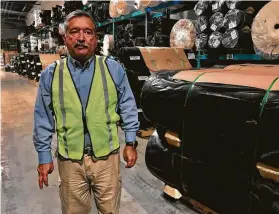  ?? Alfredo Corchado / TNS ?? Alexander Sierra, plant manager at Acme Mills, walks through his distributi­on warehouse last week in Santa Teresa, N.M., on the border with Texas. He says continual talk of tariffs creates “a chilling effect on everyone and everything.”