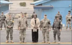  ?? -REUTERS ?? NEW YORK
US ambassador to the United Nations Linda Thomas-Greenfield (C) poses for photos with military officers during a visit to the south side of the truce village of Panmunjom in the Demilitari­zed Zone (DMZ) dividing the two Koreas.
