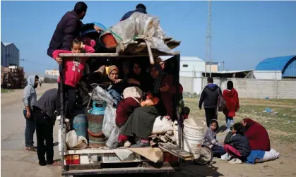  ?? ?? People arrive at the border town of Rafah on Thursday after being evacuated from Nasser hospital. Photograph: Mohammed Salem/ Reuters