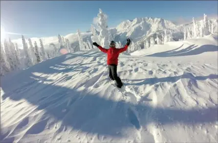  ?? RACHEL WALKER, THE WASHINGTON POST ?? Sebastian Thiry of Marseille, France, exclaims his joy at the frozen, windswept summit before shortly after a helicopter drop off on the first run of the day at Galena Lodge.