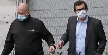  ??  ?? Off to prison: Simon Bowes-Lyon, right, is led from Dundee Sheriff Court in handcuffs yesterday