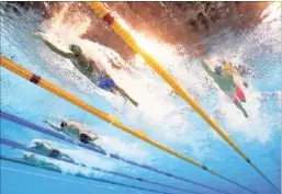  ?? PICTURE: AP ?? China’s Sun Yang, right, and South Africa’s Chad le Clos in the semi-finals of the men’s 200m freestyle yesterday.