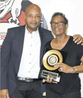  ??  ?? The COVID-19 Comfort Food Award was presented to M10 Bar & Grill Accepting the award were chef and principal Claudette Tenn and her managing director son Marvin Tenn.