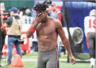  ?? Andrew Mills / Associated Press ?? Tampa Bay Buccaneers wide receiver Antonio Brown wipes his face as he leaves the field after throwing his equipment into the stands while his team is on offense during the third quarter against the New York Jets on Sunday in East Rutherford, N.J.