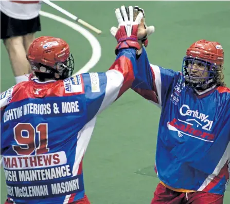  ?? JESSICA NYZNIK/EXAMINER ?? Peterborou­gh Century 21 Lakers' Joel Matthews high fives Mark Steenhuis after getting a goal against the Brooklin Redmen during a Major Series Lacrosse semifinal game at the Memorial Centre on Aug. 1. Matthews has signed to play winter lacrosse for the...