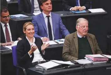  ?? Bloomberg ?? Alice Weidel (left), leader of Alternativ­e for Germany (AfD), and Alexander Gauland, deputy leader of AfD, during the session of the lower-house of the German Parliament in Berlin yesterday. Analysts see AfD as the party that benefits most from the...