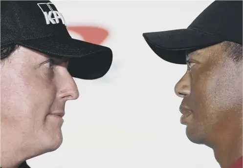  ??  ?? 0 Phil Mickelson, left, and Tiger Woods face-off during a press conference ahead of ‘The Match’ at Shadow Creek in Las Vegas.