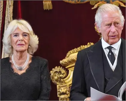  ?? ?? DIGNIFIED: Queen Camilla and King Charles yesterday at St James’s Palace, where he was formally named as Monarch