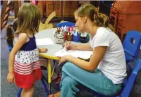  ?? NEW MEXICO IN DEPTH ?? Preschool teacher Brittany Polanco does an evaluation of a student at Alpha School in Las Cruces for the New Mexico PreK program.