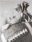  ??  ?? This photo of daughter Sadie adorns the office of Spring High School football coach Trent Miller.