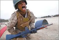  ??  ?? Kaleb Wilson, from Oceanside, runs through an obstacle course. He said the constant attention from drill instructor­s kept him on edge.