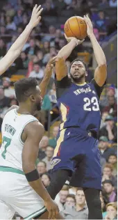  ?? AP PHOTO ?? TALL ORDER: Anthony Davis will be a handful for Jaylen Brown and the Celtics when they face the Pelicans tonight.