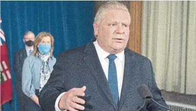  ?? FRANK GUNN THE CANADIAN PRESS ?? Doug Ford’s call for a more muscular federal stance toward vaccine suppliers (“I’d be up that guy’s ying-yang so far with a firecracke­r”) should apply equally to provincial efforts to contain the contagion, write Armine Yalnizyan and Laurell Ritchie.