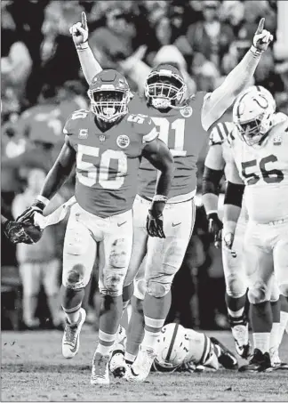  ?? DAVID EULITT/GETTY ?? Chiefs linebacker Justin Houson (50) celebrates with Derrick Nnadi after recovering a third-quarter fumble.