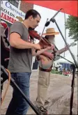  ?? (Photo by Randall Franks) ?? Tyler Andal of Nashville fiddles his way to victory at the 1890s Day Jamboree Old Time Fiddle Convention in Ringgold.